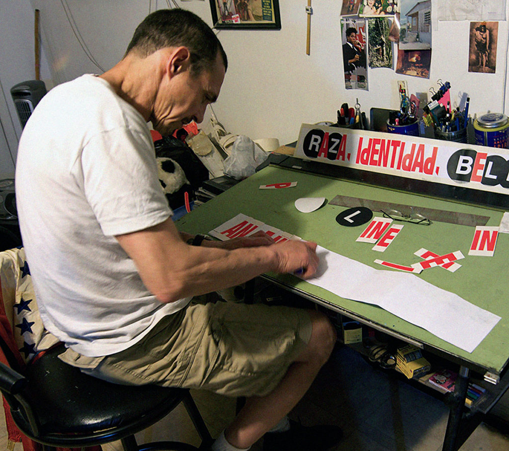 Diaz at work on his "WET PAINT" collages. 