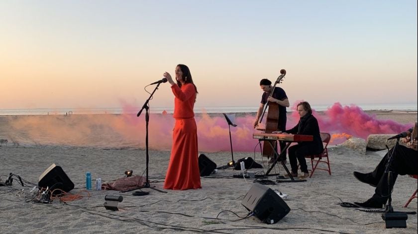 Ariana Vafadari performs an operatic piece, inspired by an ancient Iranian water deity, at the Bombay Beach Biennale. Photo by Gregg Pichler courtesy of the Bombay Beach Biennale.