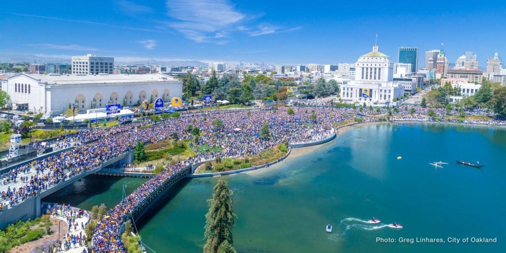 Warriors fans take to the streets of Oakland. The Oakland Museum of California is behind the trees in the center of the photograph, next to the large white building on the left, but is almost impossible to make out Photo by Greg Linhares, courtesy of the city of Oakland.