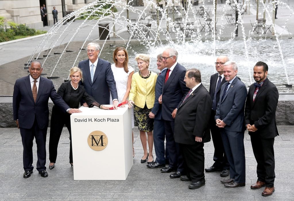 The unveiling of the David H. Koch Plaza at the Metropolitan Museum of Art on September 9, 2014. Left to right: Mitchell Silver, New York City Parks Commissioner; congresswomen Carolyn Maloney; David H. Koch; Julia Koch; Emily K. Rafferty, president of the Metropolitan Museum of Art; and congressman Jerrold Nadler. Photo by Paul Zimmerman/WireImage.