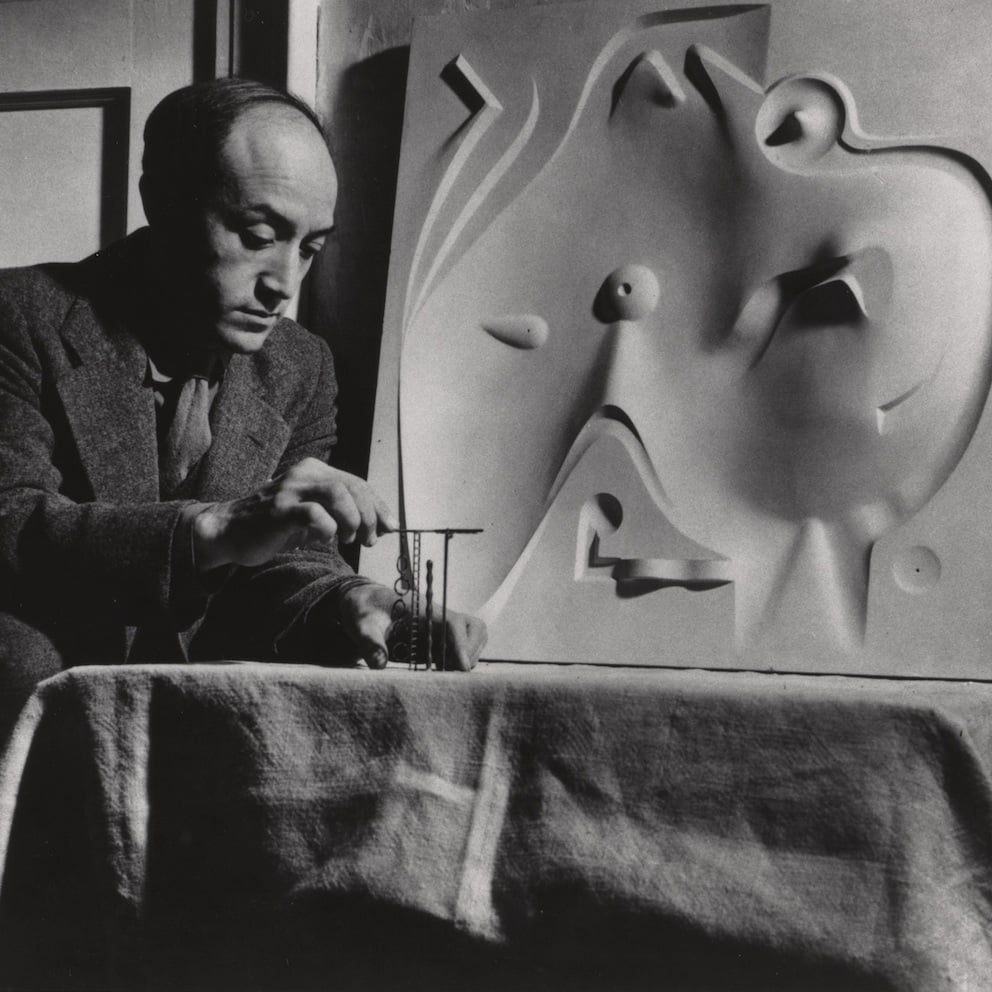 Isamu Noguchi with plaster model for <em>Contoured Playground</em> (1941) and model for a jungle gym element for Ala Moana Park (circa 1940). Photo courtesy of the Noguchi Museum Archive, ©INFGM/ARS.