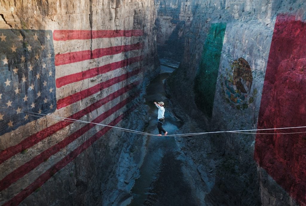 Kylor Melton, The Imaginary Line a still shows Corbin Kunst walking a highline over the US and Mexico border in Santa Elena Canyon. Photo courtesy of Kylor Melton.