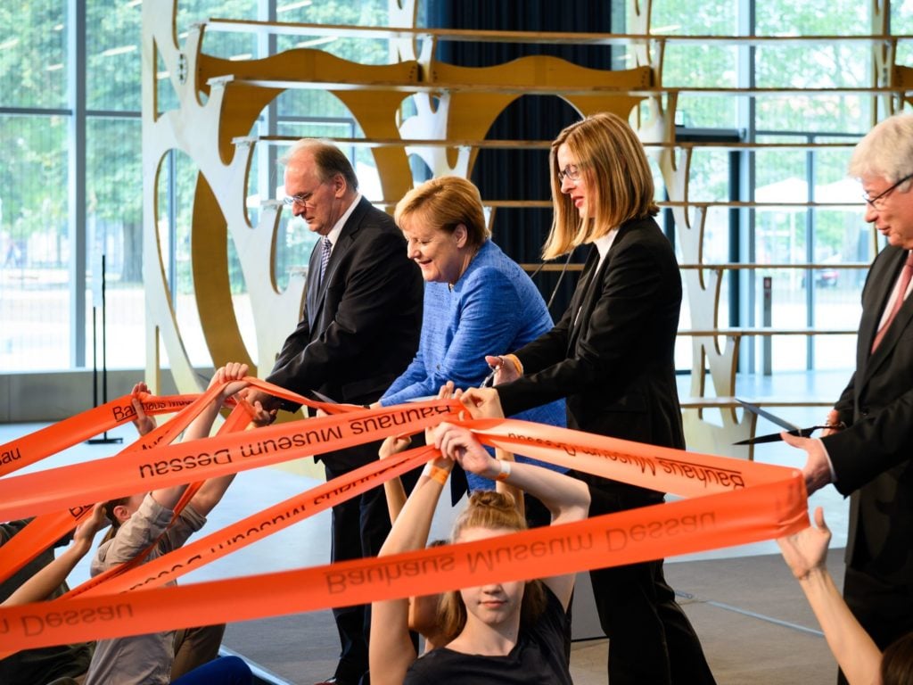 Angela Merkel cuts the opening ribbon of the Bauhaus Museum Dessau, September 8, 2019. Copyright Stiftung Bauhaus Dessau.