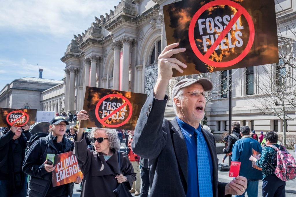 Activists outside the Metropolitan Museum of Art call for urgent action to end the climate emergency on March 24, 2019. Photo by Erik McGregor, Pacific Press/LightRocket via Getty Images.