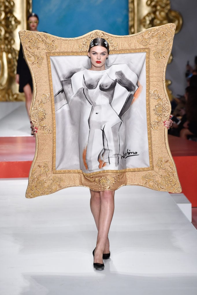 Cara Taylor walks the runway at the Moschino show during the Milan Fashion Week. Photo by Pietro D'Aprano/Getty Images.
