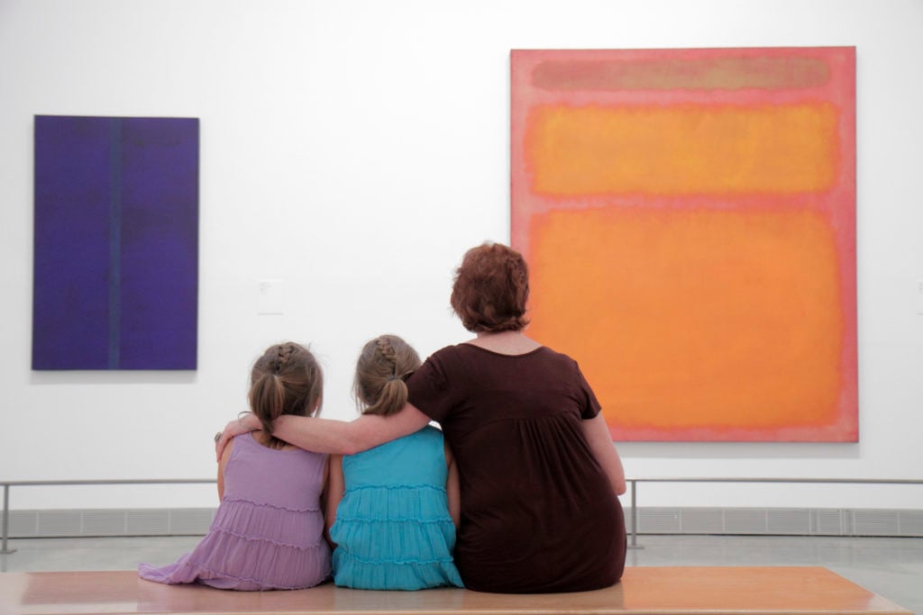 A mother and her daughters looking at Mark Rothko paintings in the Philadelphia Museum of Art. (Photo by: Jeffrey Greenberg/Universal Images Group via Getty Images)