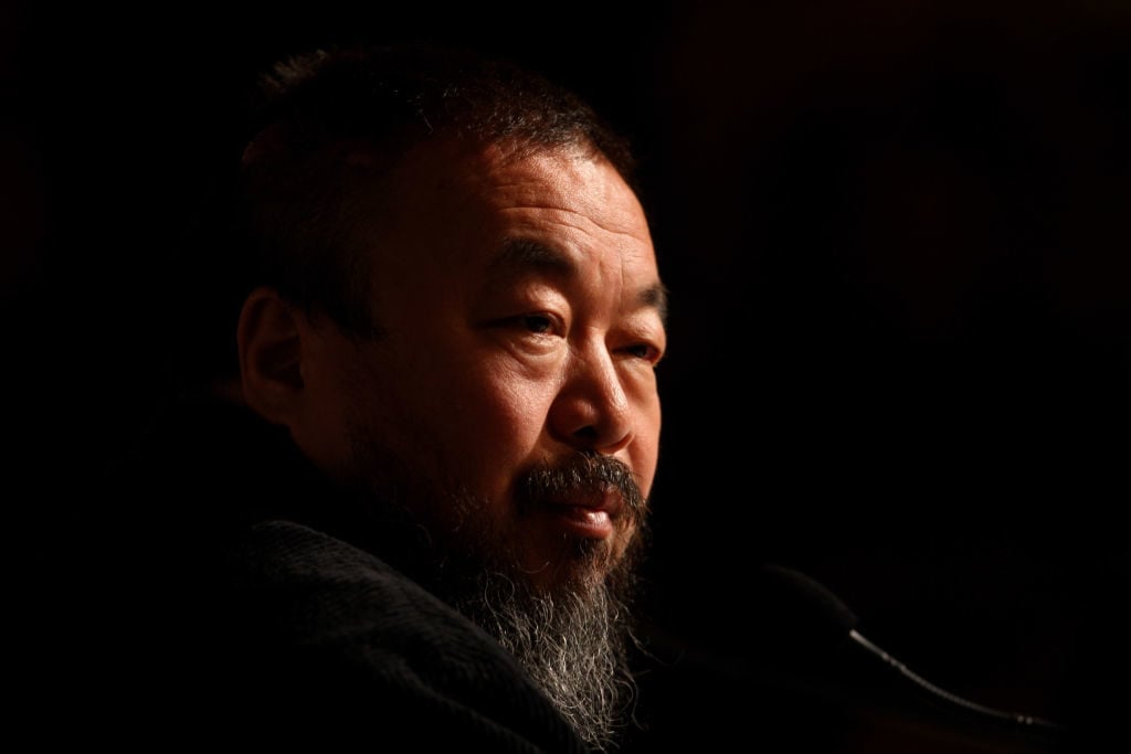 Ai Weiwei, one of China's most controversial artists, looks on during his solo exhibition 