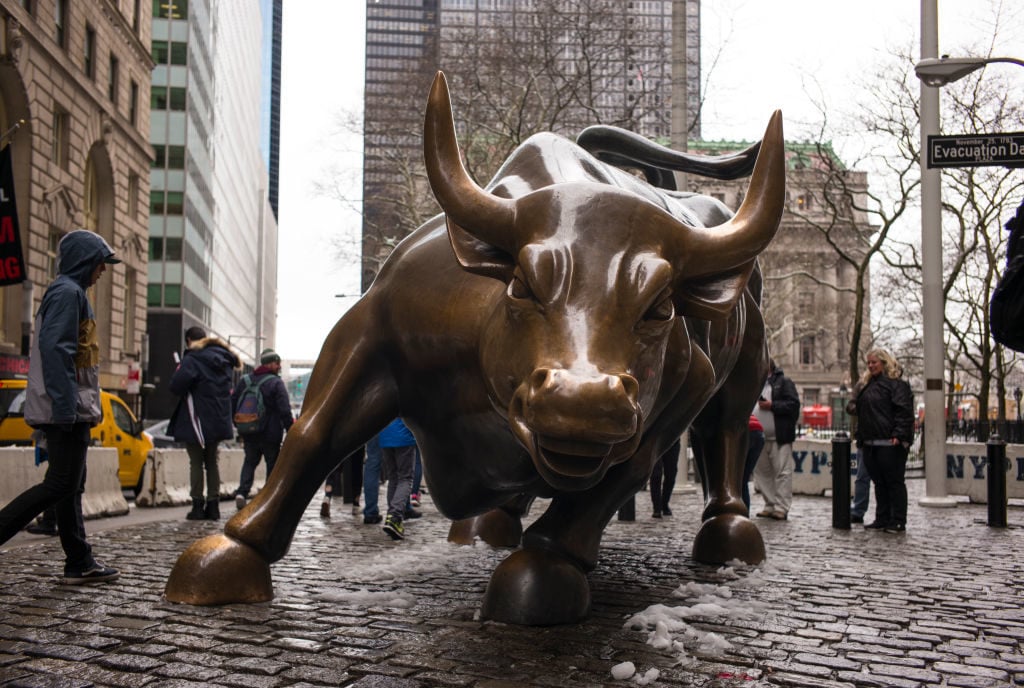 The bronze Charging Bull sculpture stands near the Financial District April 2, 2018 in New York City. Photo by Robert Nickelsberg/Getty Images.