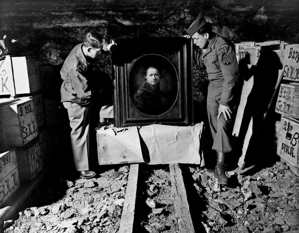 A Rembrandt self-portrait recovered at a German salt mine that had been used as a storehouse, with Harry L. Ettlinger, right. Photo courtesy of the Monuments Men Foundation.