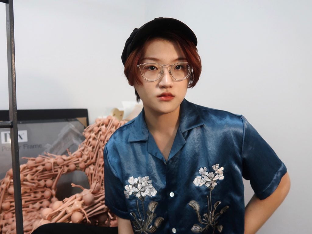 Twenty-two year old artist Ran Zhou has been importing plastic dolls from Chinese factories to make her latest series of works.