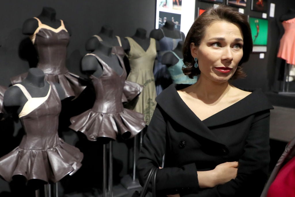 A woman attends the opening of "Impresario. The Trajectory of Dance" at Moscow's Bakhrushin Museum. (Photo by Vyacheslav ProkofyevTASS via Getty Images)