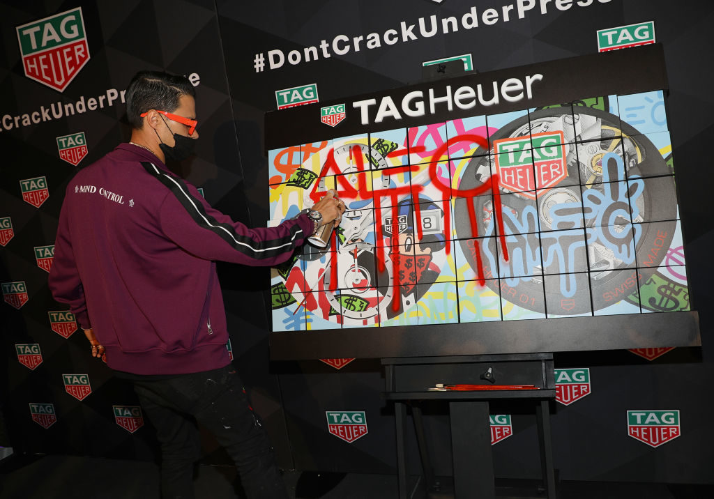 Art Provocateur Alec Monopoly celebrating the new TAG Heuer Boutique Aventura. Photo by Alexander Tamargo/Getty Images for TAG Heuer.