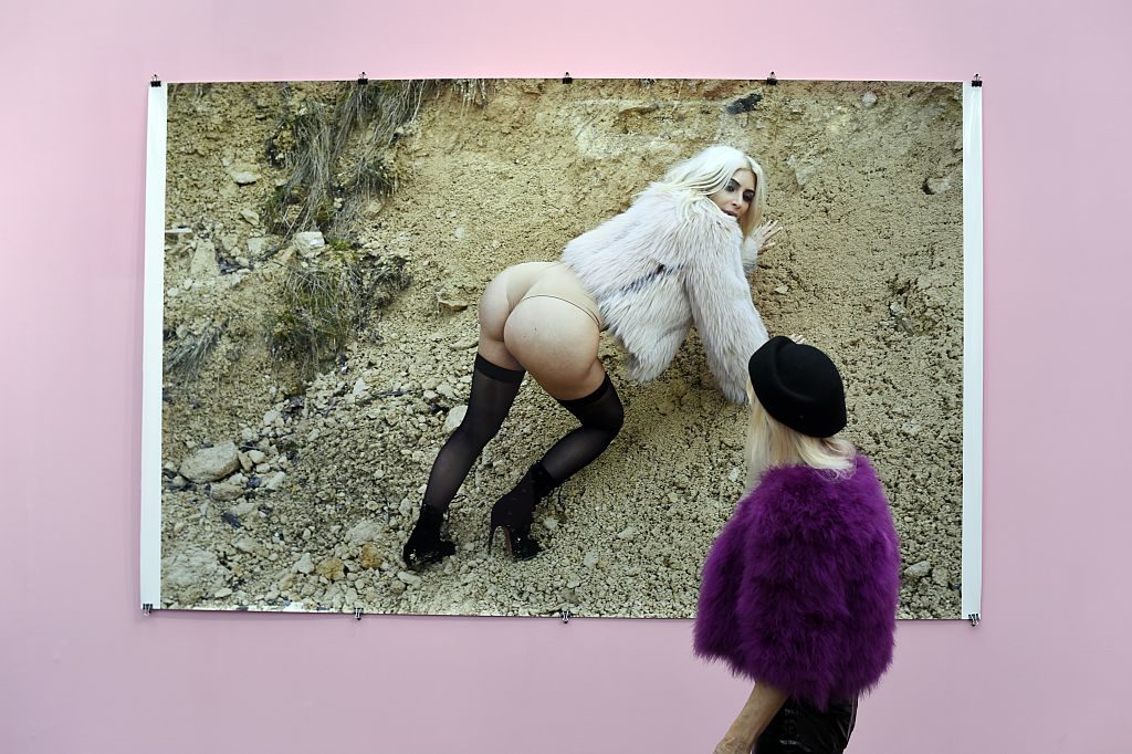 A visitor with a photo of Kim Kardashian by Juergen Teller during the 2015 Paris Photo fair. A work from the series will be on view at the König Galerie's inaugural Tokyo exhibition. Photo: AFP/Miguel Medina/Getty Images.