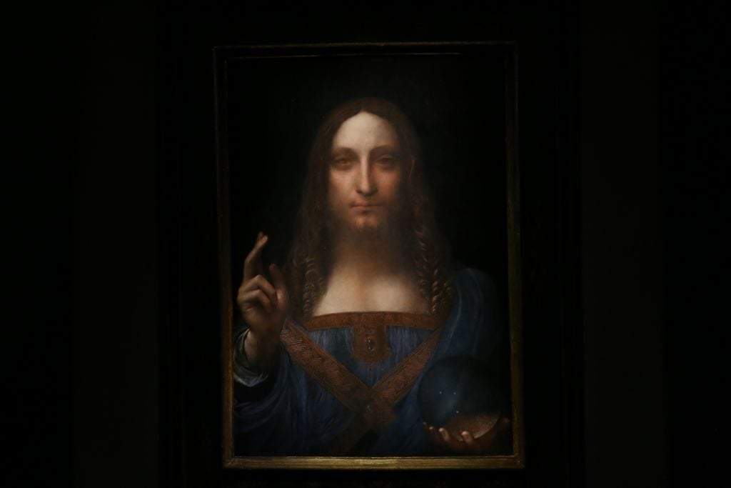 Leonardo da Vinci's Salvator Mundi painting is seen at the Christie's in New York in 2017. Photo by Mohammed Elshamy/Anadolu Agency/Getty Images.