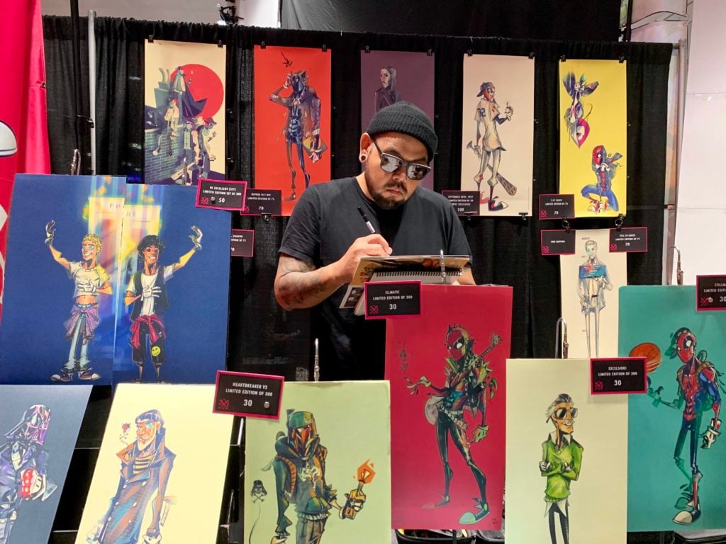 Nooligan draws at his booth at New York Comic Con. Photo by Sarah Cascone. 