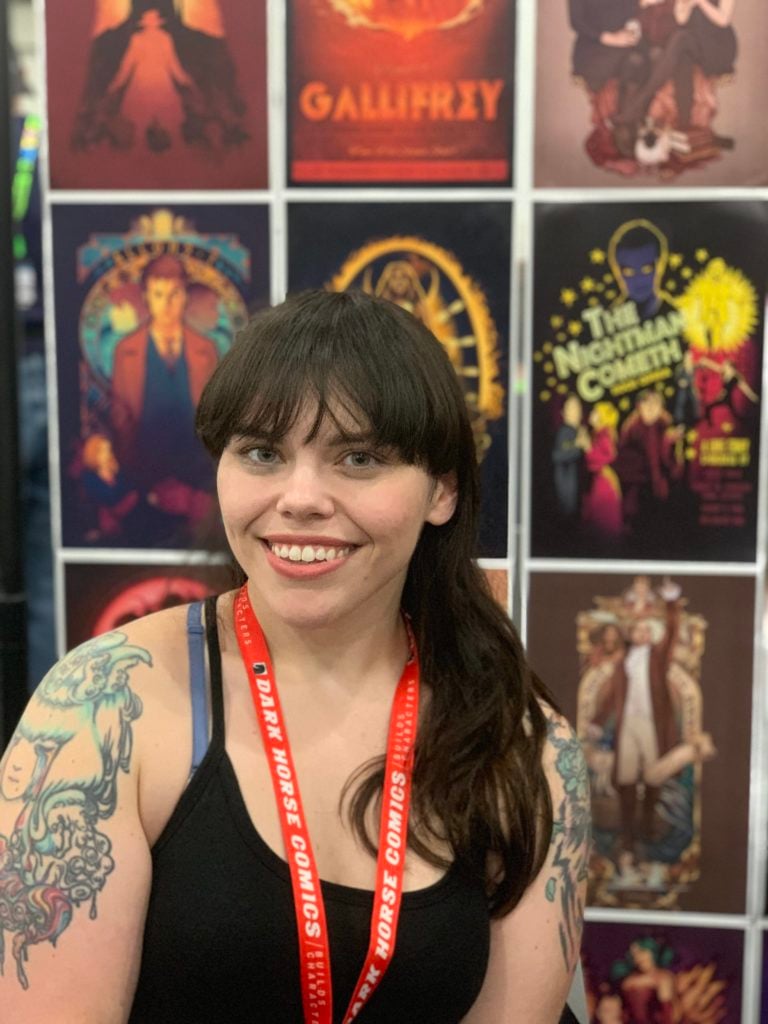 Megan Lara with her work at Artist Alley at New York Comic Con. Photo by Sarah Cascone. 
