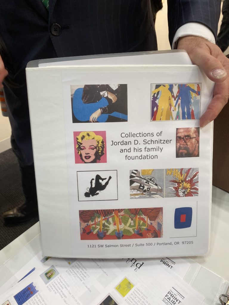 Print collector Jordan Schnitzer had a binder listing his entire collection at the ready at the International Fine Print Dealers Association’s Fine Art Print Fair. Photo by Sarah Cascone. 