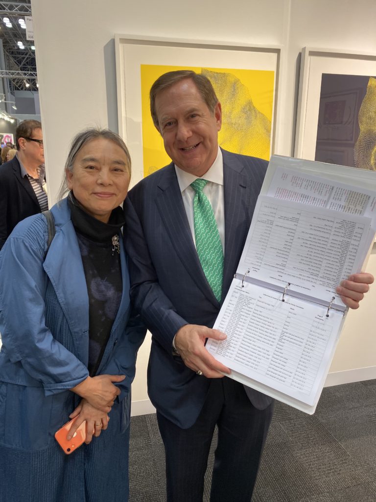 Artist Hung Liu and collector Jordan Schnitzer, who showed her a list of her works in his collection when they met for the first time at the International Fine Print Dealers Association’s Fine Art Print Fair. Photo by Sarah Cascone. 