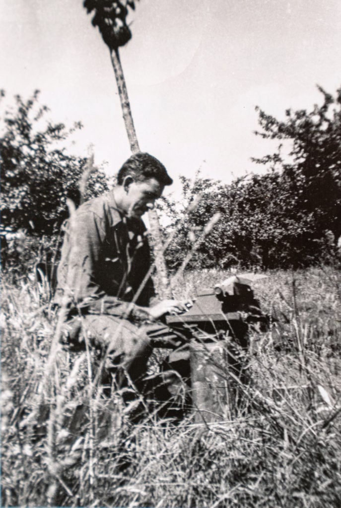 J.D. Salinger with typewriter in Normandy, France (1944). Photo courtesy of the the New York Public Library, Astor Lenox and Tilden Foundations, and the J.D. Salinger Trust.