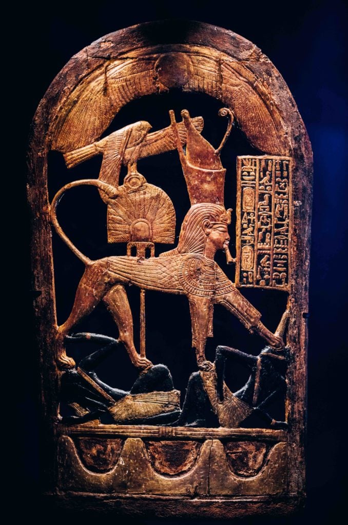 Wooden Ceremonial Shield with King as Sphinx Trampling on Nubian Enemies. Image courtesy IMG.