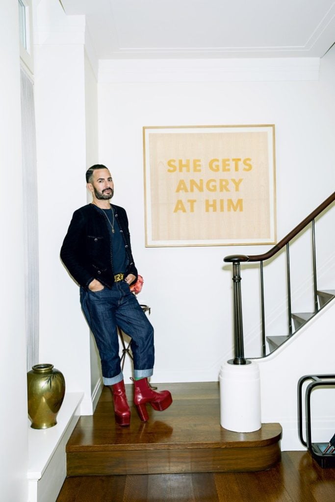 Marc Jacobs with Ed Ruscha's <em>She Gets Angry With Him</em>, which carries an auction estimate of $2 million–3 million. Photo by Victoria Stevens courtesy of Sotheby's New York.