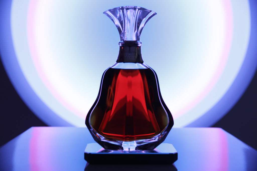 A Hennessy Paradis Imperial decanter designed by Arik Levy in front of Toruses by Phillip K. Smith III. Photo courtesy Quinn P. Smith.