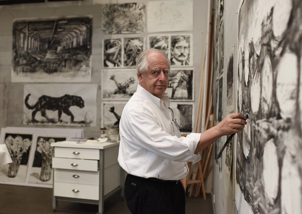 William Kentridge with his piece <em>Smoke, Ashes, Fable</em>. Photo by Stella Olivier, courtesy of Musea Brugge. 