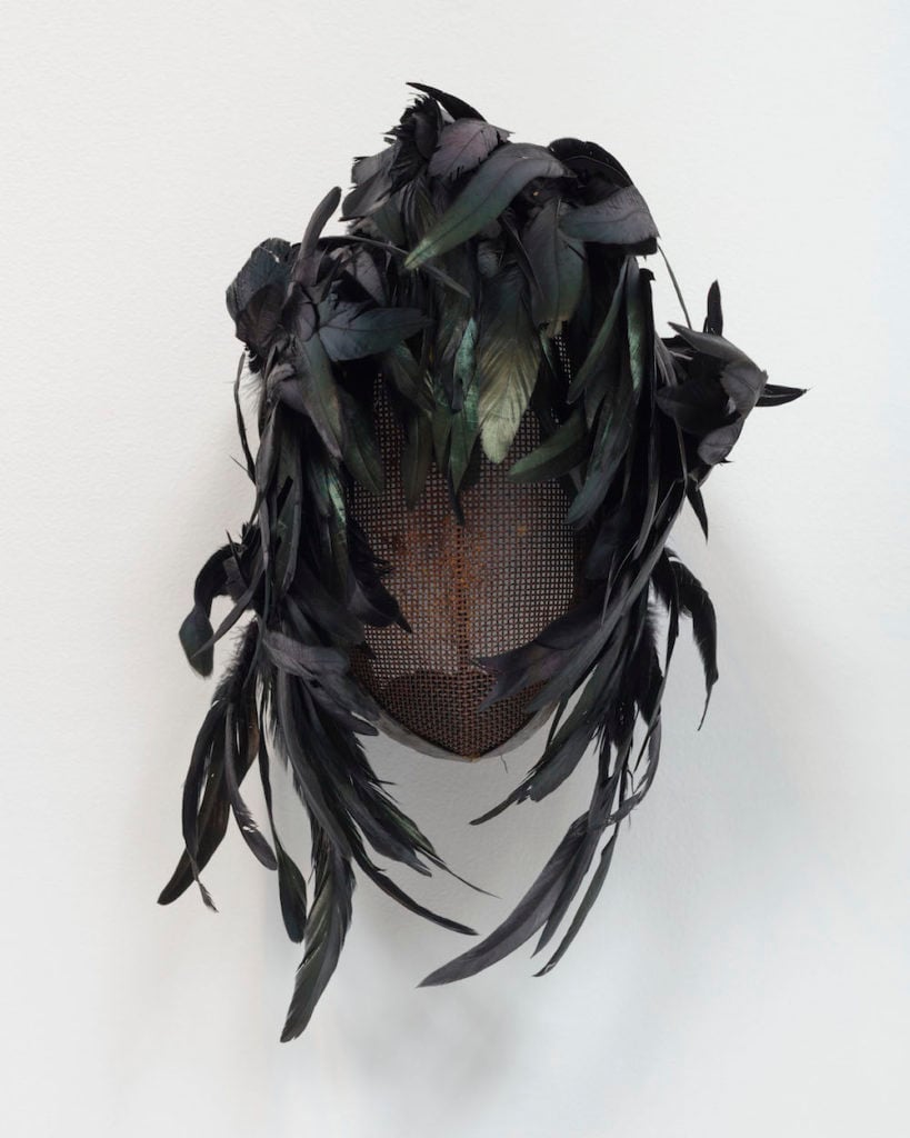 Allison Janae Hamilton, Fencing Mask with black feather headress (2019. Image courtesy of the artist and Marianne Boesky.