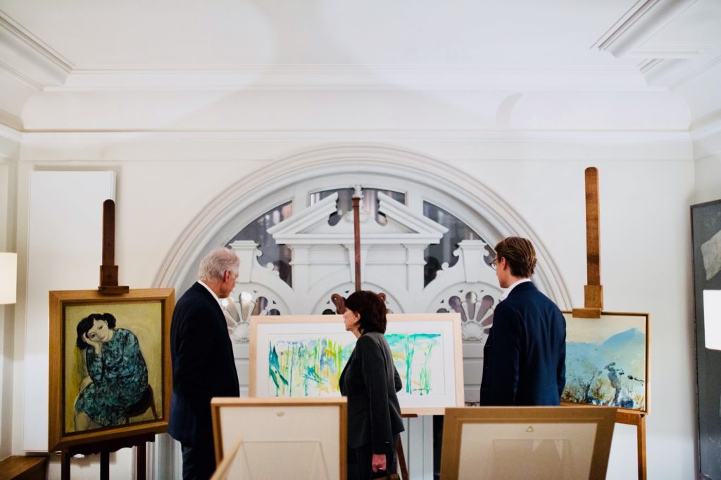Arthur and Dominique Villepin stand with Zao Wou-Ki's widow Francois in front of the late artists work.