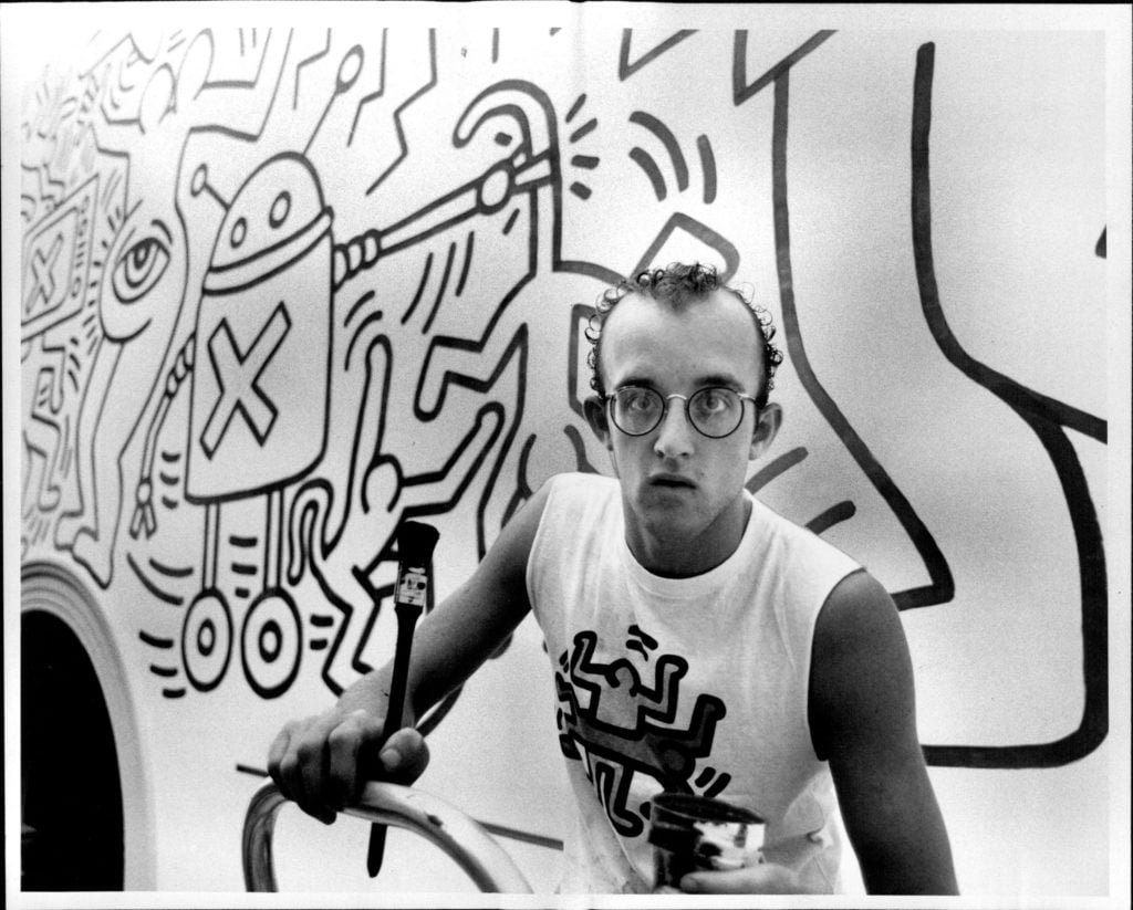 Artist Keith Haring at work on another one of his murals n 1984. (Photo by Stuart William Macgladrie/Fairfax Media via Getty Images)