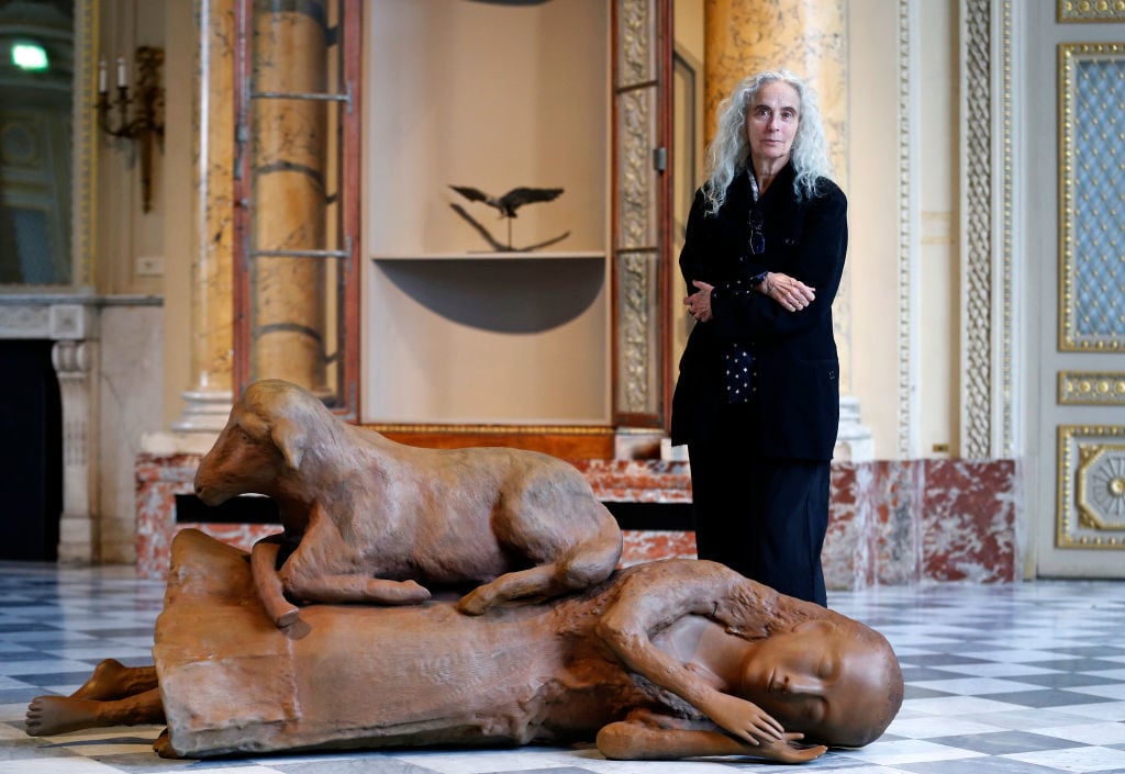 Kiki Smith poses next to her artwork at the 'Monnaie de Paris' on October 17, 2019 in Paris, France. Photo by Chesnot/Getty Images.