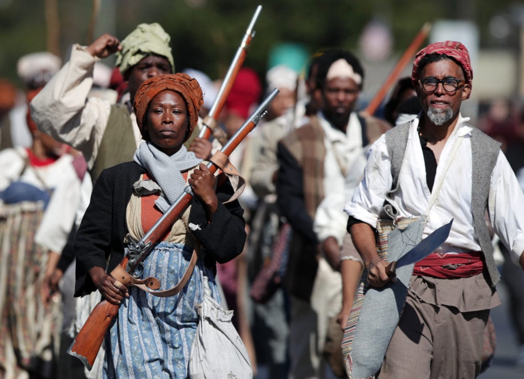 Reenactors retrace the route of one of the largest slave rebellions in U.S. history on November 09, 2019 in New Orleans, Louisiana. (Photo by Marianna Massey/Getty Images)