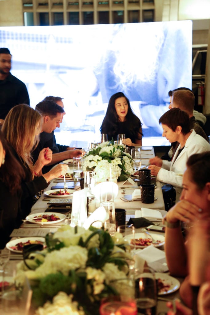 Dinner guests enjoying conversation. Photography © Jordan Braun.