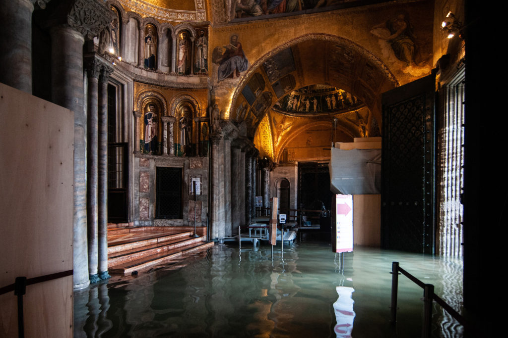 A view inside the flooded St. Mark's Basilica during the floods on November 13 in Venice. Photo by Simone Padovani/Awakening/Getty Images.