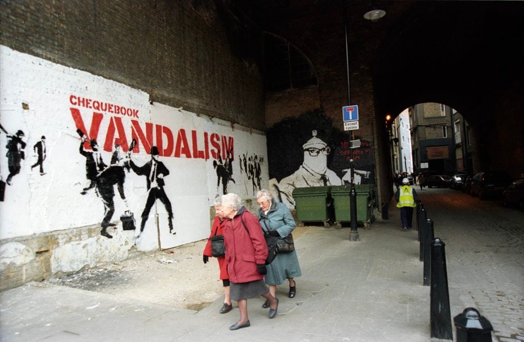 <i>Chequebook vandalism</i> from "Banksy Captured" courtesy of Steve Lazarides. 