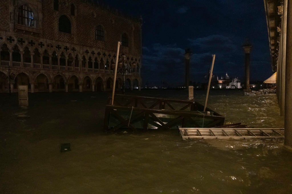A jetty of gondoliers floats in Piazza San Marco during the floods on November 12, 2019 in Venice. Photo by Stefano Mazzola/Awakening/Getty Images.