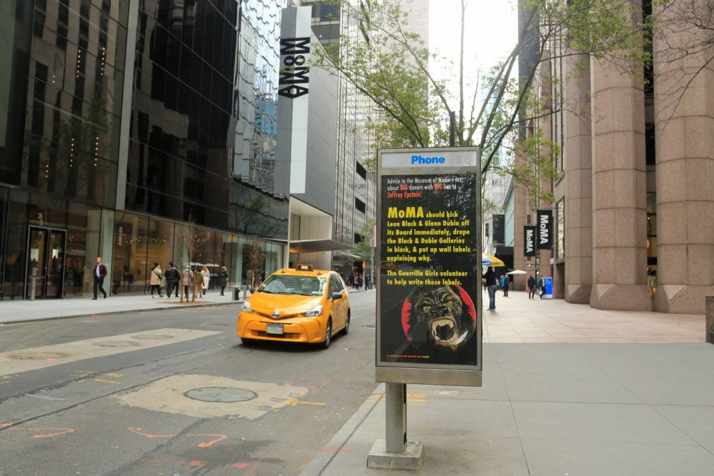 The Guerrilla Girls poster calling on the Museum of Modern Art to cut ties with donors linked to Jeffrey Epstein. Photo by Luna Park, courtesy of Art in Ad Places.