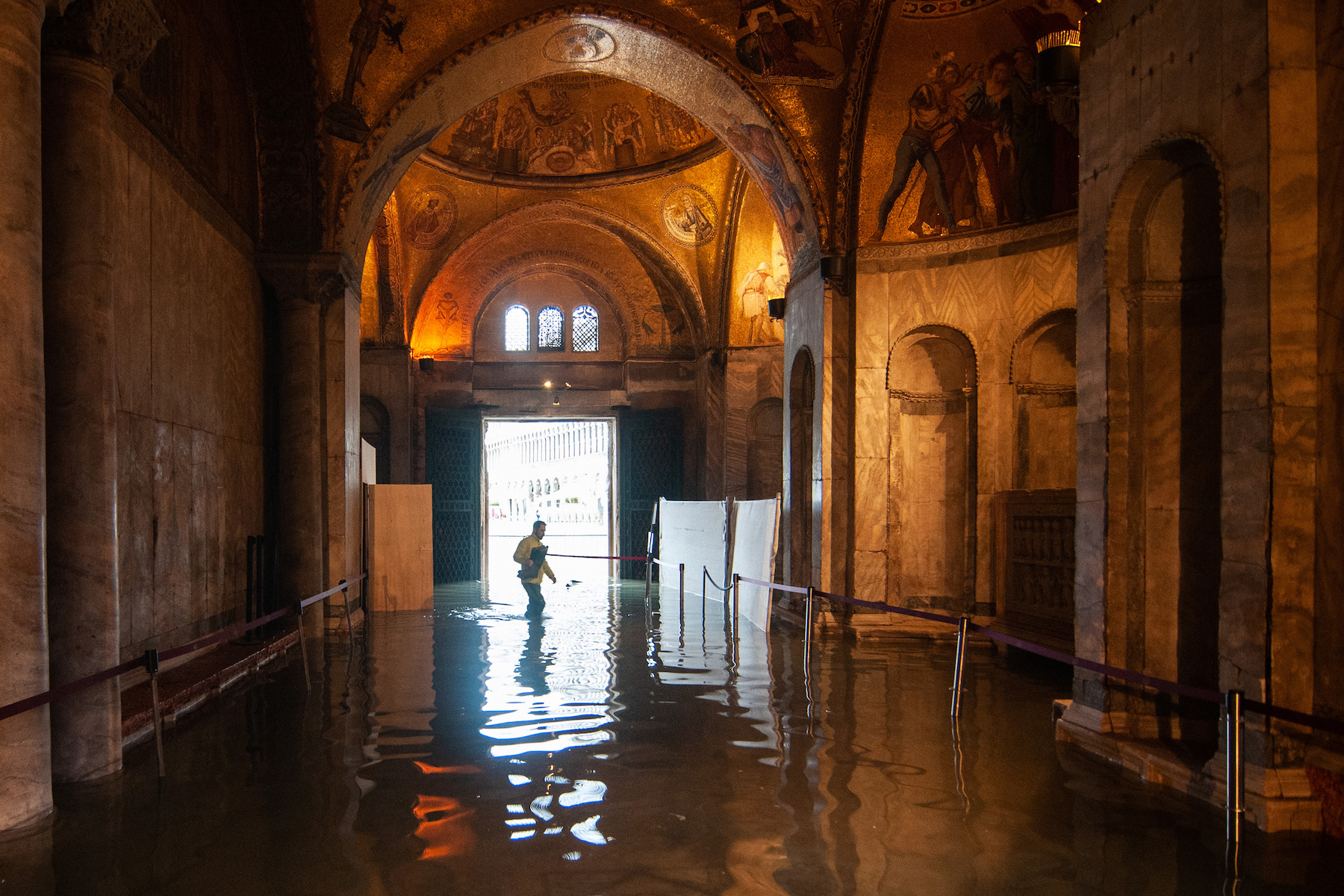 A view inside the flooded St. Mark's Basilica during the floods on November 13 in Venice. Photo by Simone Padovani/Awakening/Getty Images.