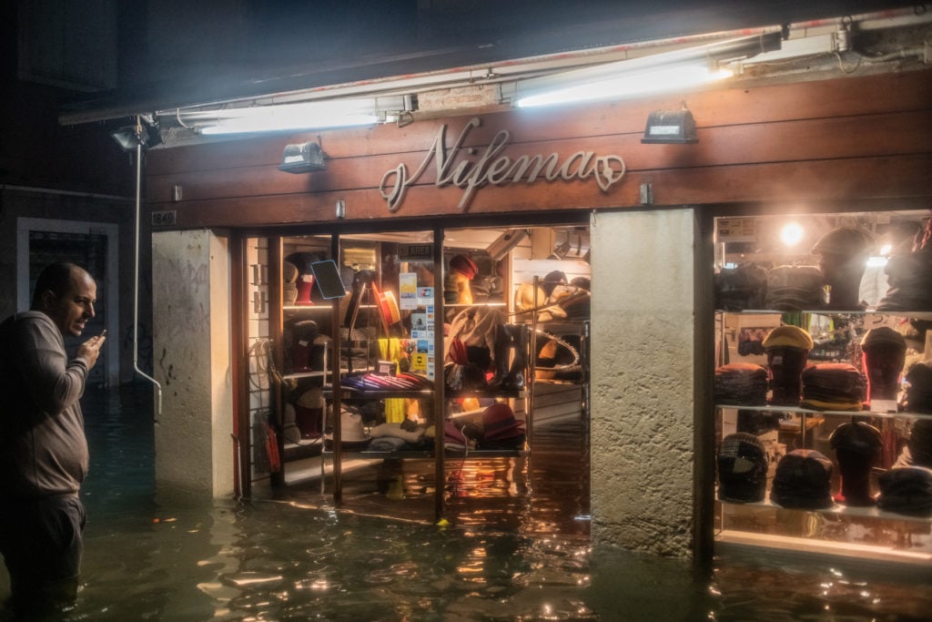 Damage can be seen inside a shop during an exceptional high tide on November 13, 2019 in Venice, Italy. Photo by Simone Padovani/Awakening/Getty Images.
