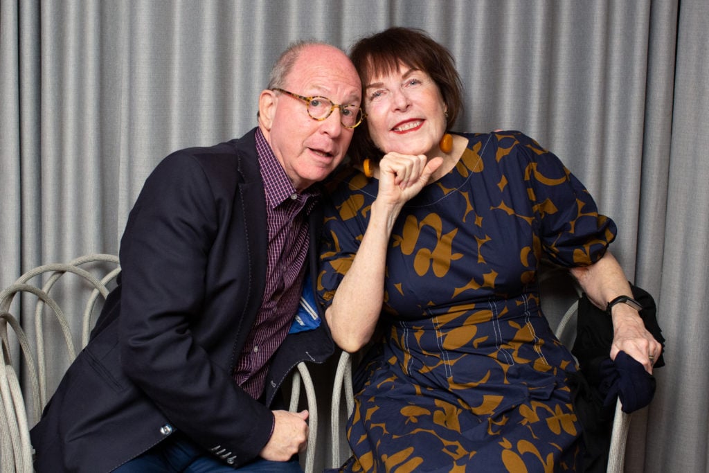 Jerry Saltz and Marilyn Minter at Playboy's Art Basel Miami Beach dinner. Photo by Tiffany Sage, courtesy of BFA.