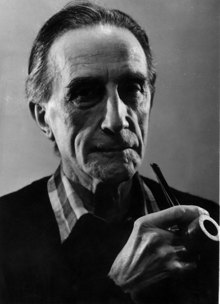 The artist Marcel Duchamp (1887-1968) holding a pipe. (Photo by Hulton Archive/Getty Images)