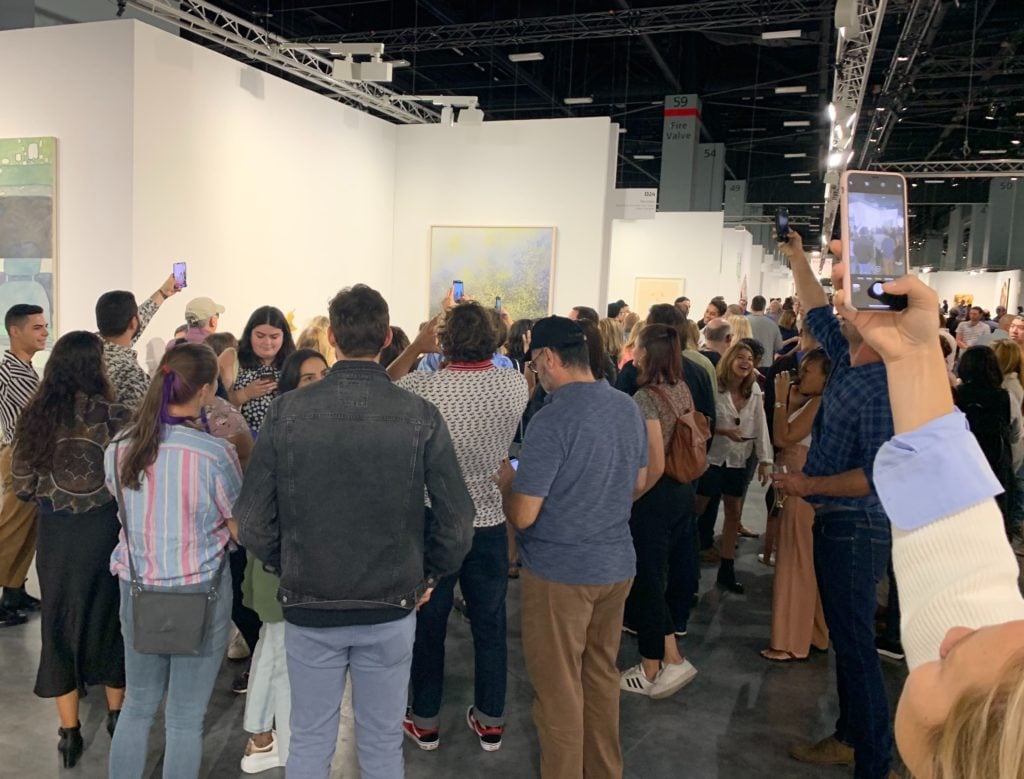 The crush to see the banana at Art Basel Miami Beach on Saturday. Photo by Andrew Goldstein.