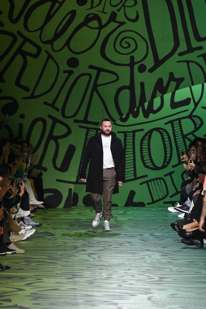 Kim Jones at the show finale. Photo courtesy Getty Images.