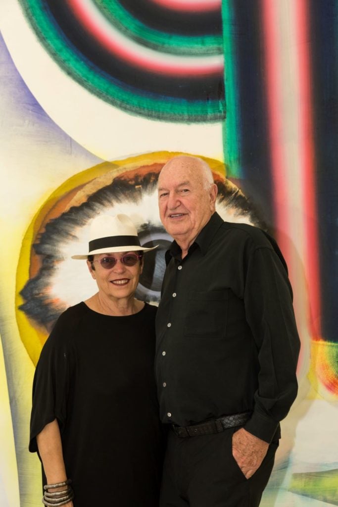 Mera and Don Rubell in front of Kerstin Brätsch’s artwork When You See Me Again It Wont Be Me(from BroadwaybratschCorporate Abstraction series), 2010. Photo by Chi Lam. Image courtesy of the Rubell Museum.