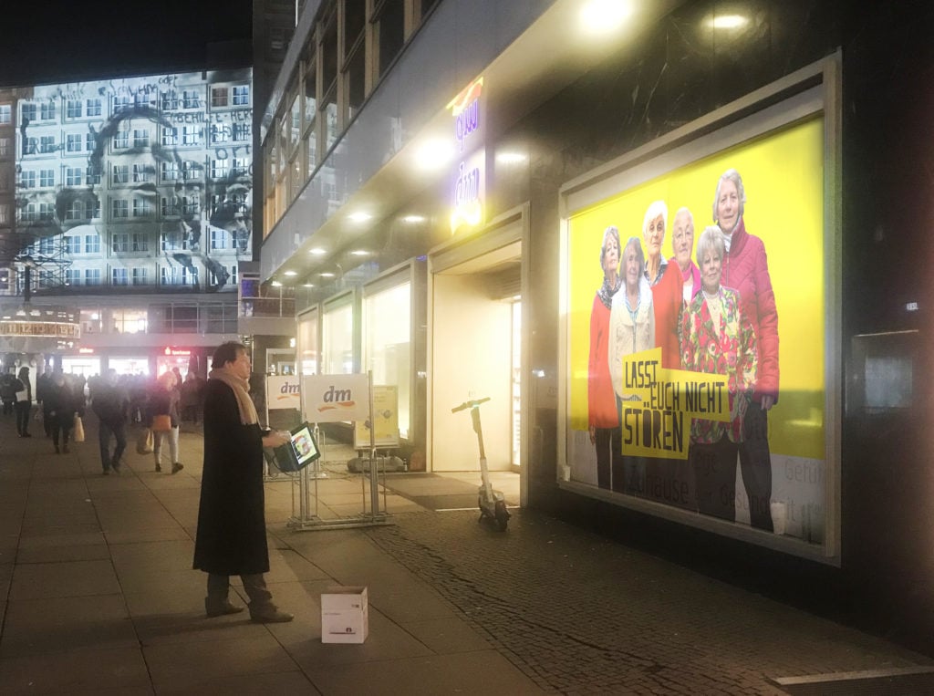 David Graeber with a projector for the November 9 action in Alexanderplatz. Image courtesy the Yes Women.