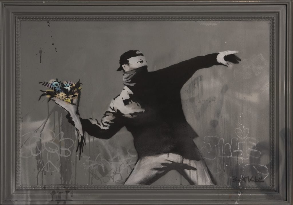 Banksy, Love is in the Air (2015). Courtesy Phillips.