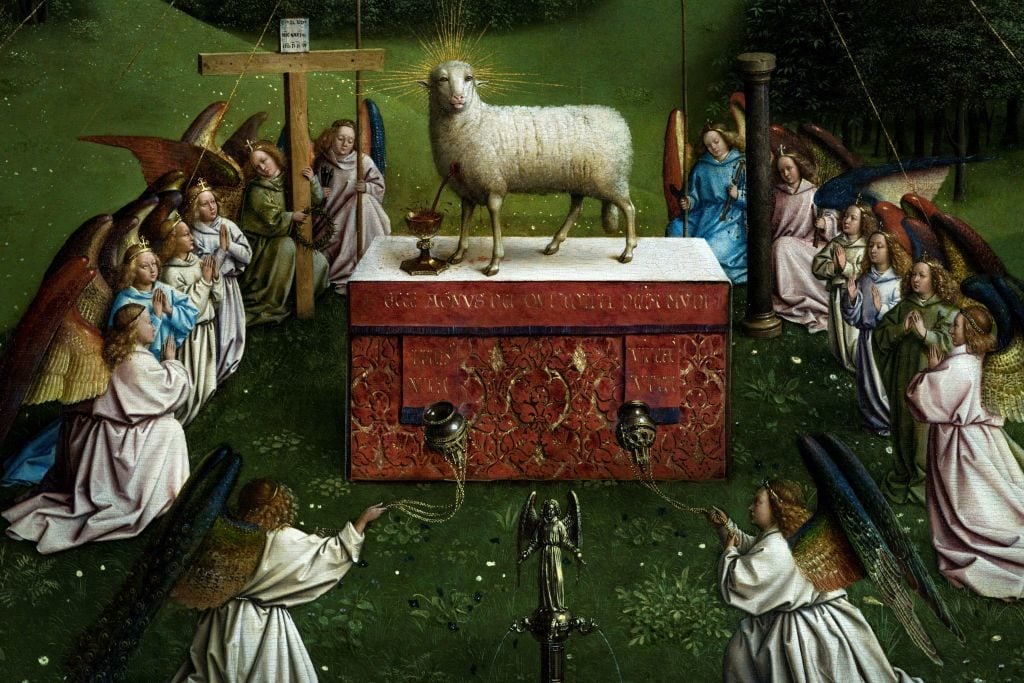 A picture taken on December 17, 2019 shows a detail of the restored original of Adoration of the Mystic Lamb altarpiece (1432) by the brothers and Flemish artists Hubert van Eyck and Jan van Eyck at the Museum of Fine Arts Ghent (MSK) in Ghent, Belgium.(Photo by Kenzo Tribouillard / AFP via Getty Images.