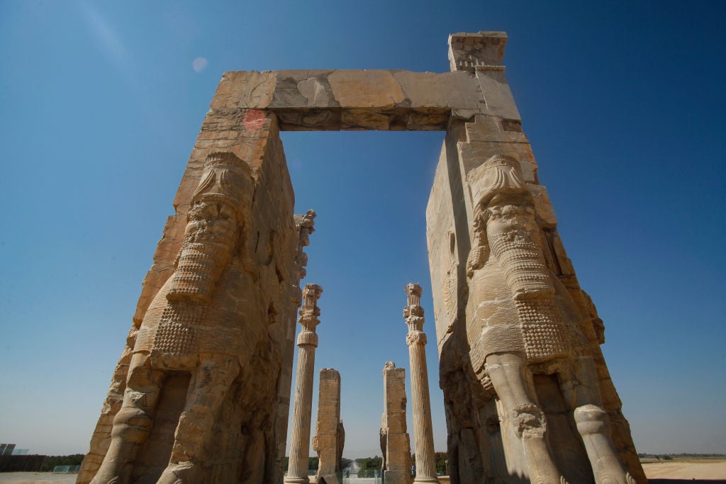 The archaelogical site and ruins of gates and columns of the Persian Achaemenid dynasty ancient capital city of Persepolis. Photo by Nicolas Economou/NurPhoto via Getty Images.