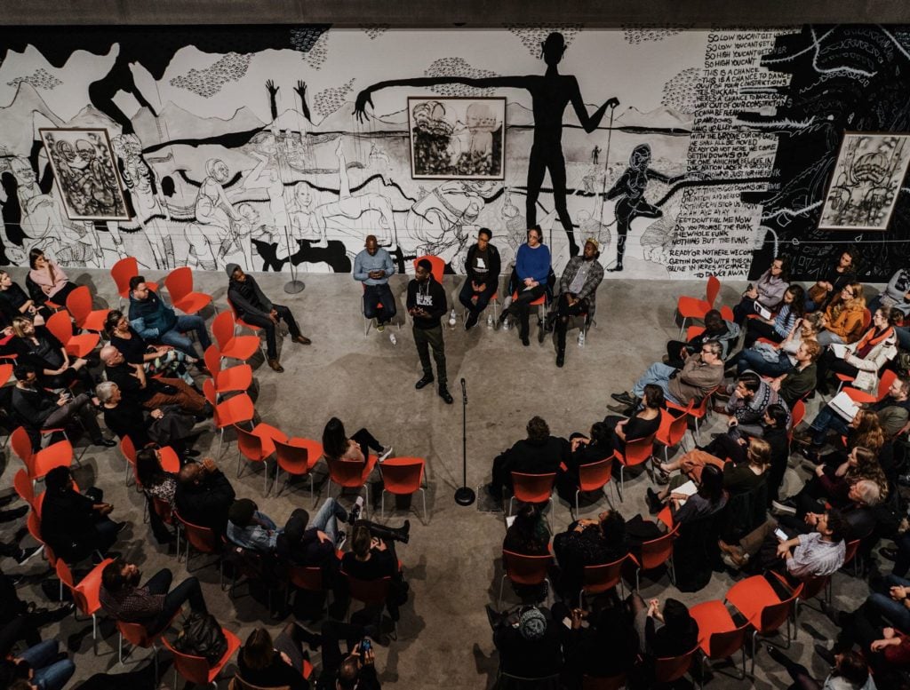 Town hall at the Contemporary Art Museum St. Louis, 2018, as part of For Freedoms Town Hall: The 50 State Initiative. Photo by Virginia Harold.
