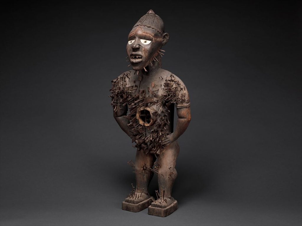 Nkisi Nkondi, 19th century, Republic of Congo, Angola, Chiloango River region. Wood, plant fiber, iron, resin, ceramics, textile, pigment. Yombe artist. Courtesy of The Metropolitan Museum of Art.